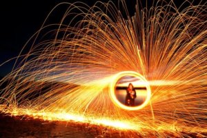 Spinning burning steel wool throws off dramatic sparks